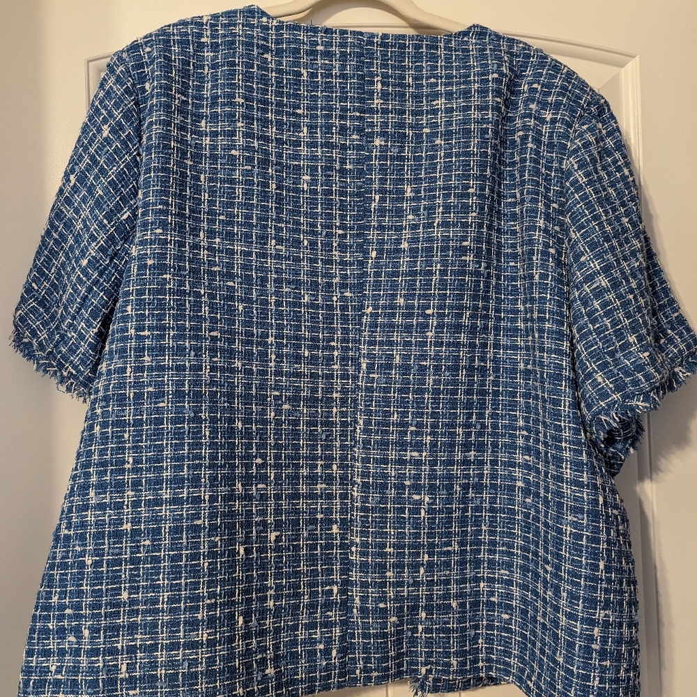 A nice top light coat on top of a blouse or dress